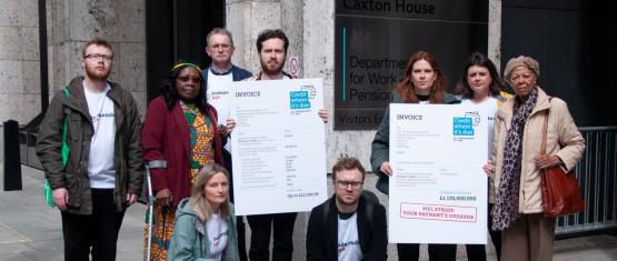 Group of campaigners holding Pension Credit invoice