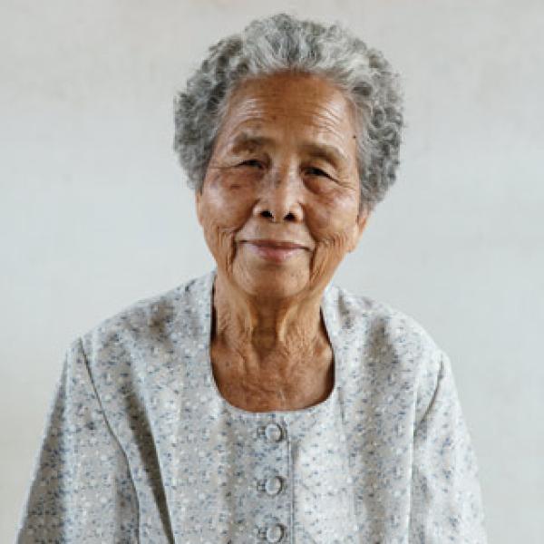 Older woman in grey