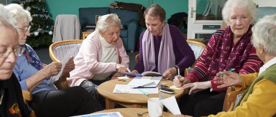 A group of older people planning a campaign