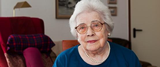 An older woman staring into the camera