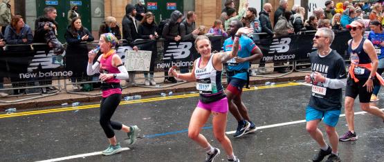 Runner waving as they go past