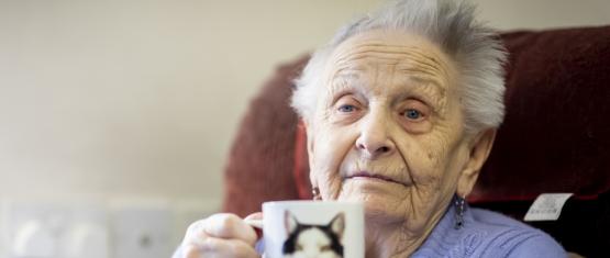 Older woman holding a mug