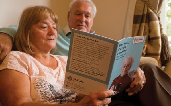 Man and woman reading care home guide
