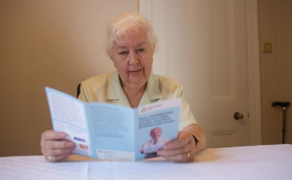 Woman reading leaflet