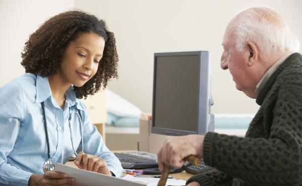 An older man in a GP appointment