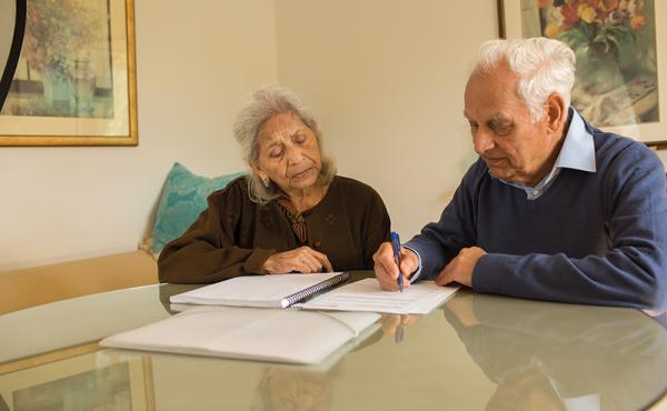 Man and woman filling in a form