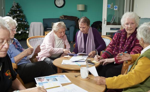 A group of older people planning a campaign