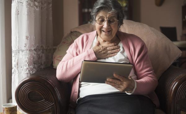 Smiling woman using a tablet