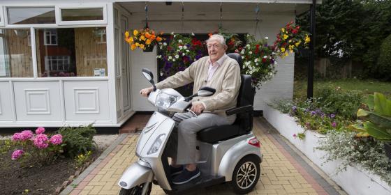 older man on a mobility scooter