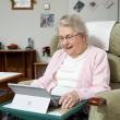 Older person reading on a tablet