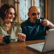 Older couple watching laptop screen