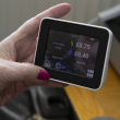 Smart energy meter held in someone's hand