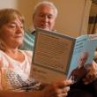 Man and woman looking at care home guide